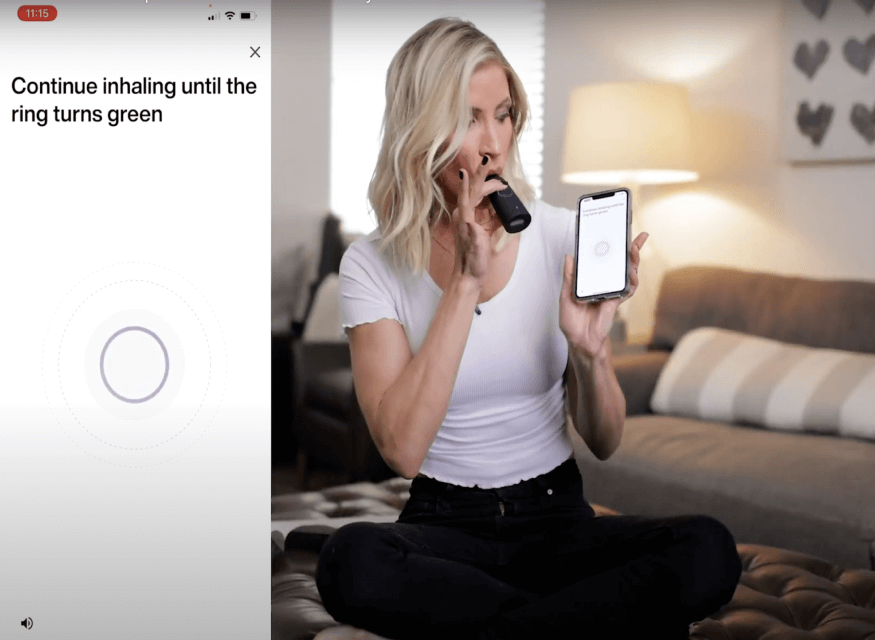 A women is using lumen's device and it's apps